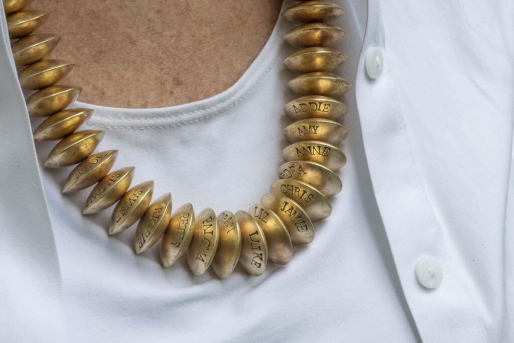 Embossed brass bead necklace